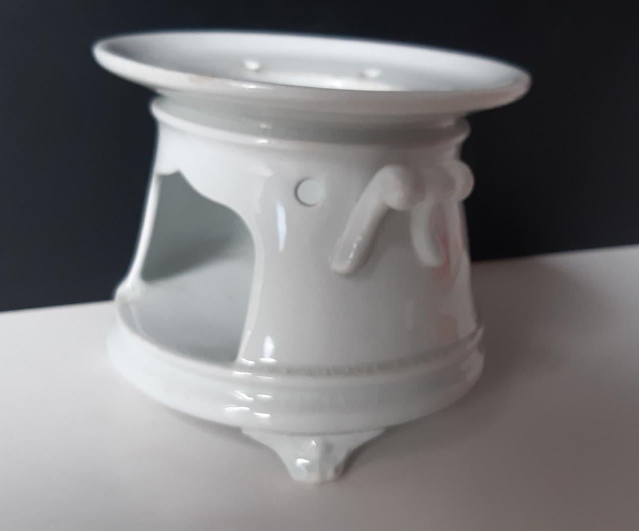 Petrus Regout wit theelicht op pootjes met vetschuitje