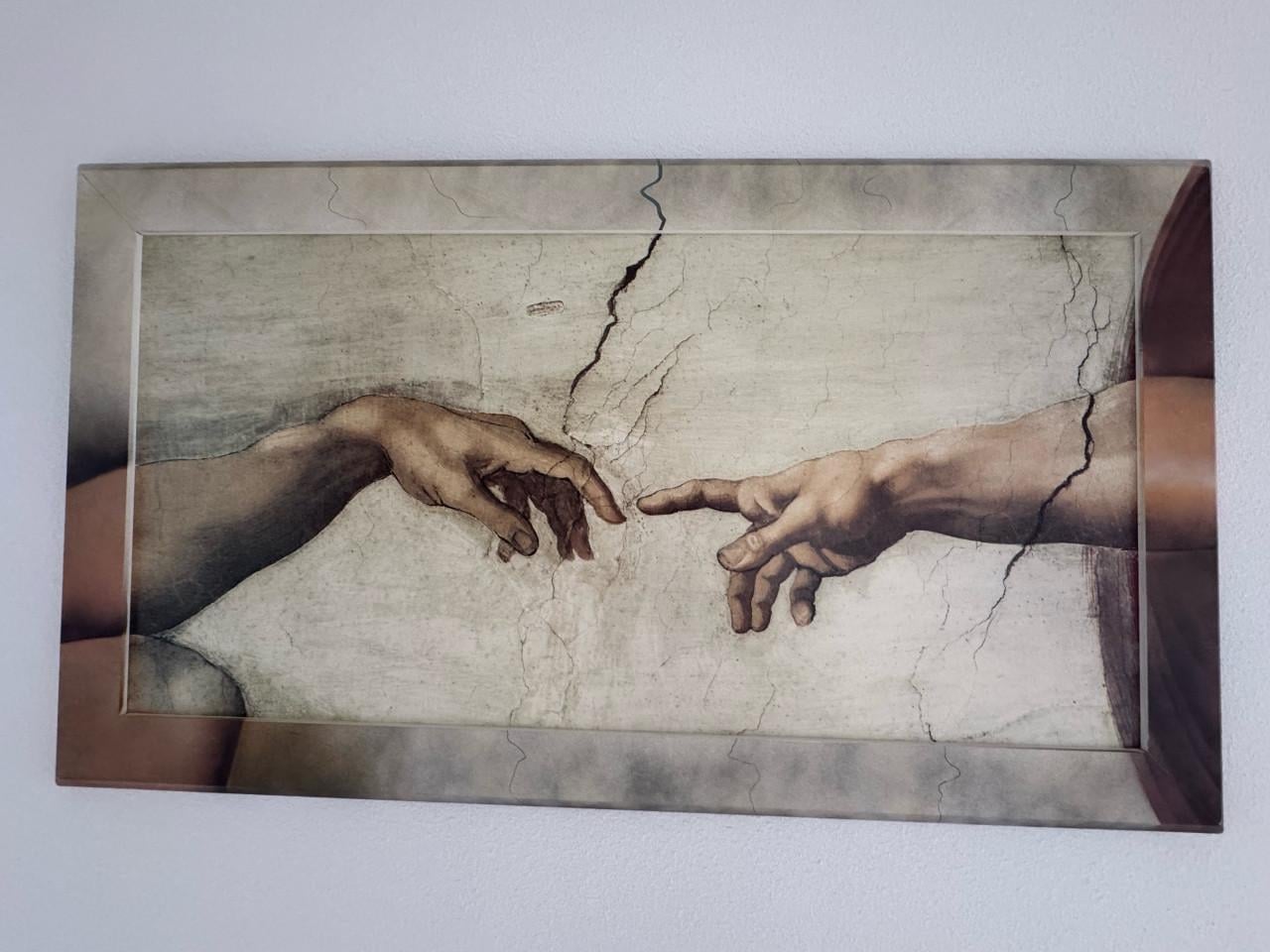 Muurdecoratie "Handen van God en Adam" van Michelangelo