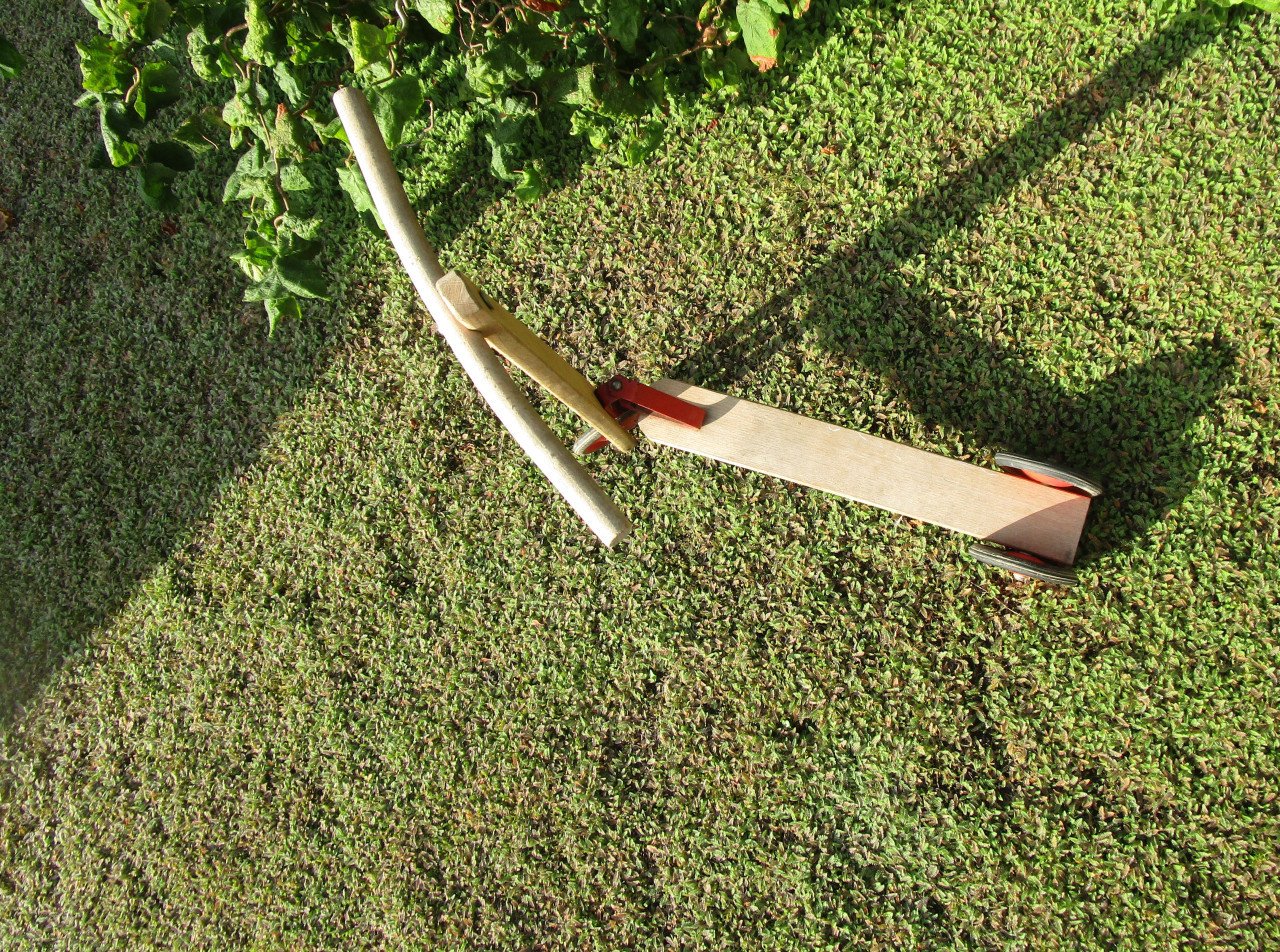 Houten drie wiel stepje.