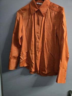 Oranje blouse met lange mouw. Zara Maat S