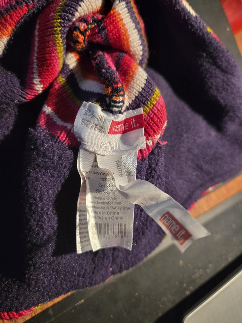 Muts met oorflappen en pompon van name It , maat 92-98