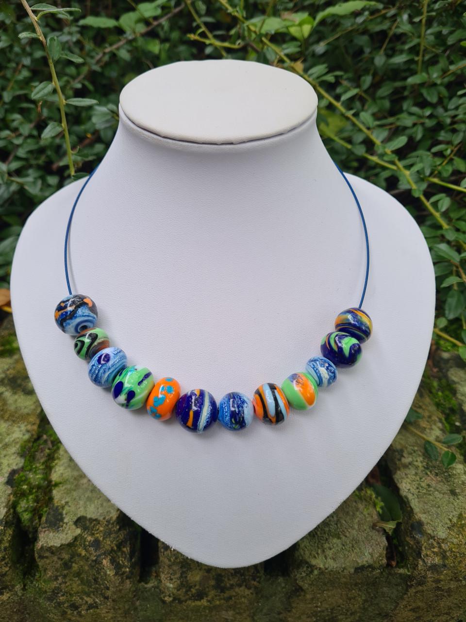 Glaskralen maken achter de brander