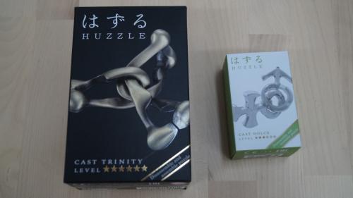 2x Huzzle puzzle, cast Trinity en cast Dolce