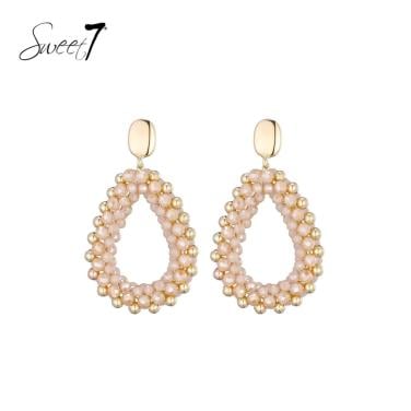 Oorbellen met creme en goudkleurige kralen