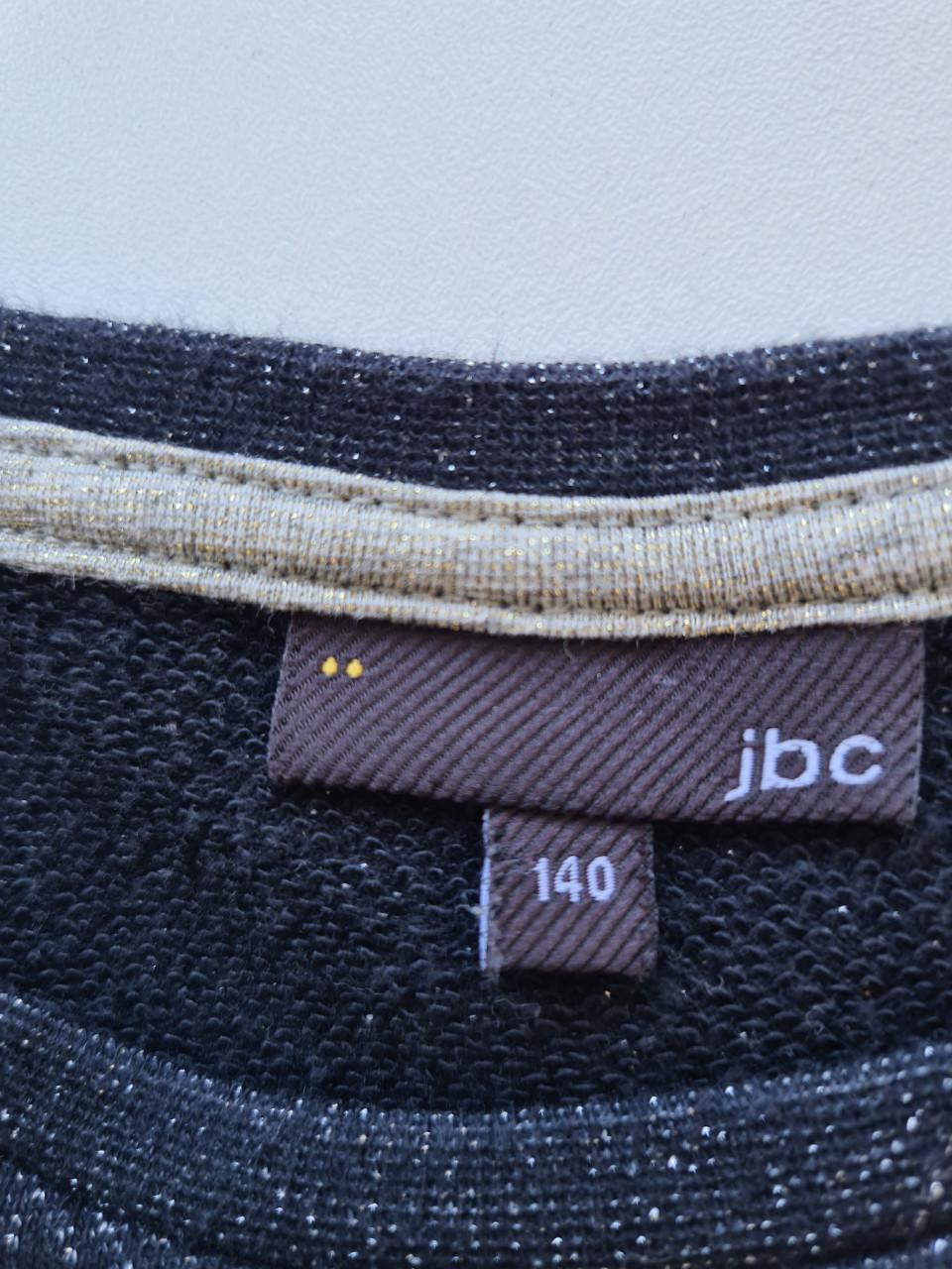 Donkergrijs jurkje met glitters en pailletten van JBC  Maat 140