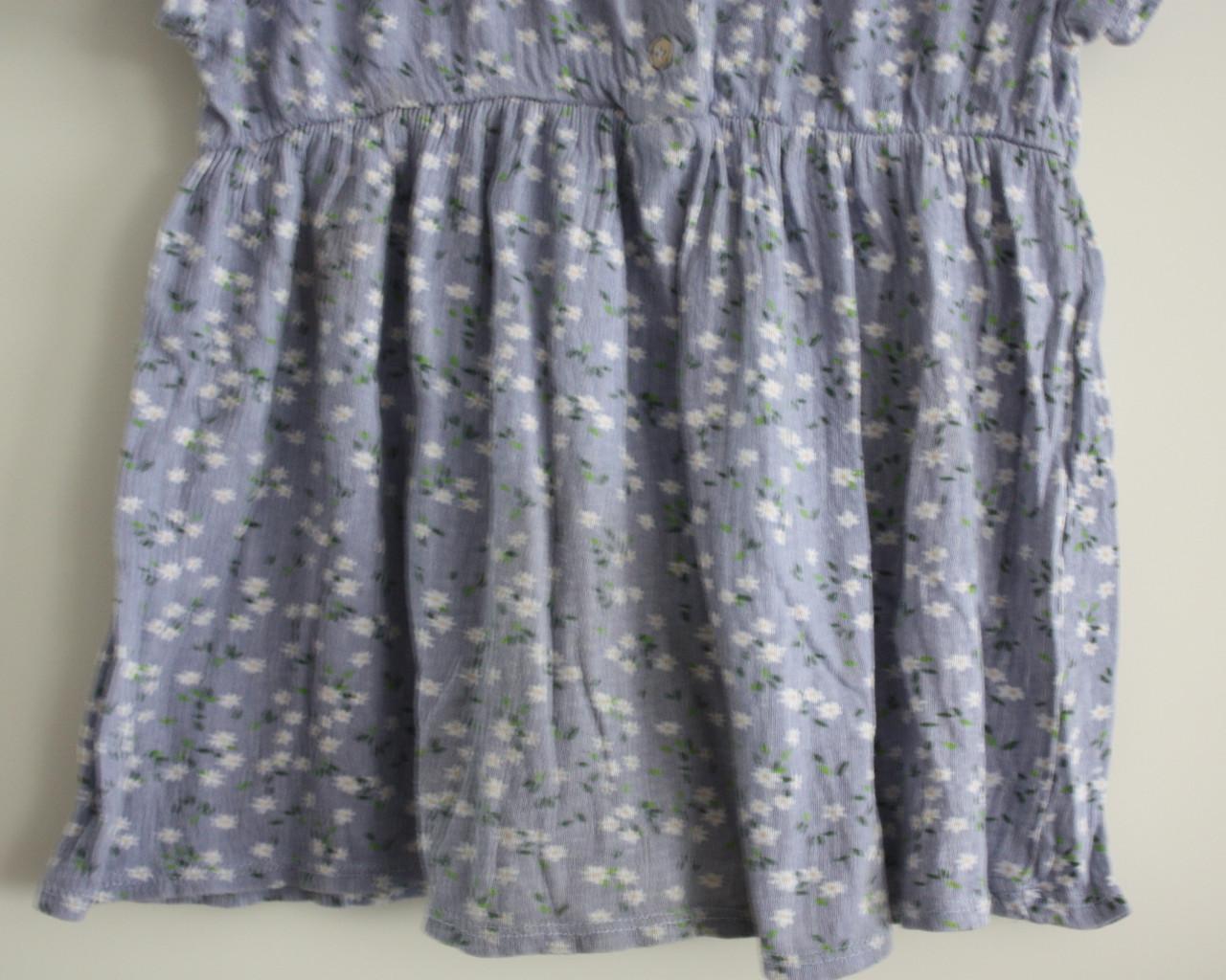 Blauw jurkje met bloemen print maat 86