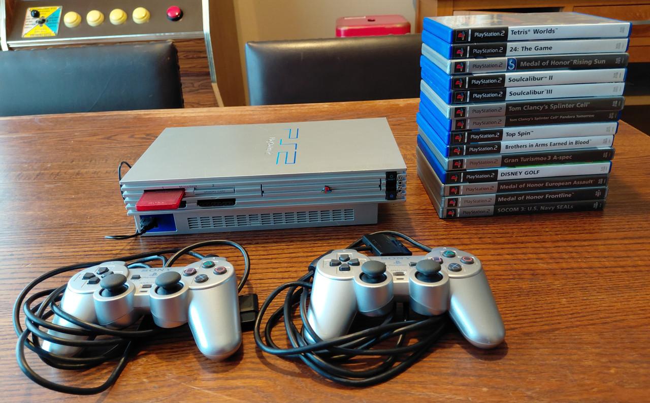 Tekoop playstation 2 met 14 games