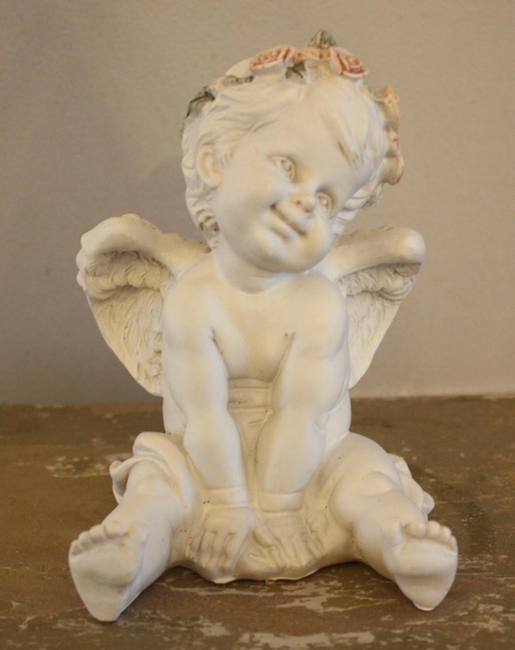 Engel met roosjes krans