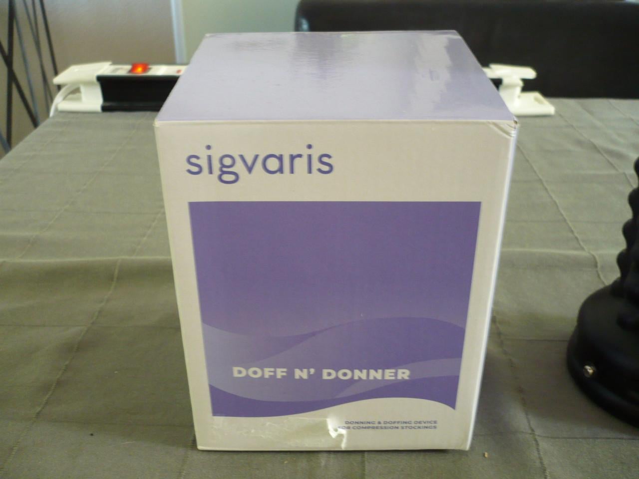 DOFF N’ DONNER aan en uittrekhulp-zo goed als nieuw