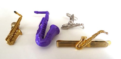 Saxofoon speldjes en manchetknoop
