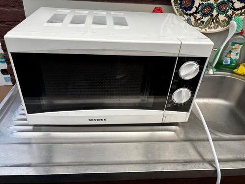 Nieuwe (senioren) magnetron met boekje