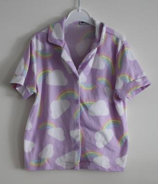 Blousj met regenboog print maat 110-116