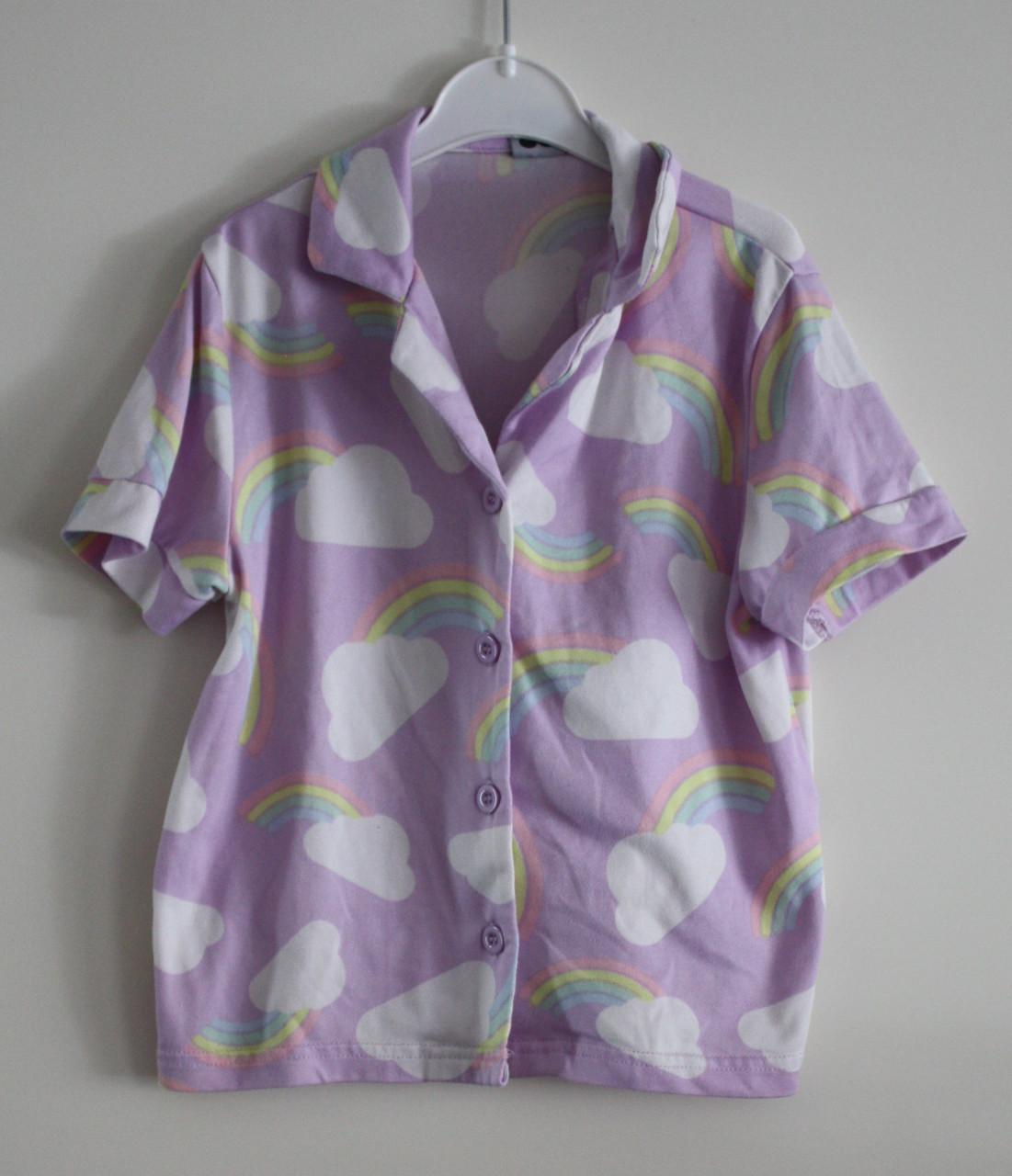 Blousj met regenboog print maat 110-116