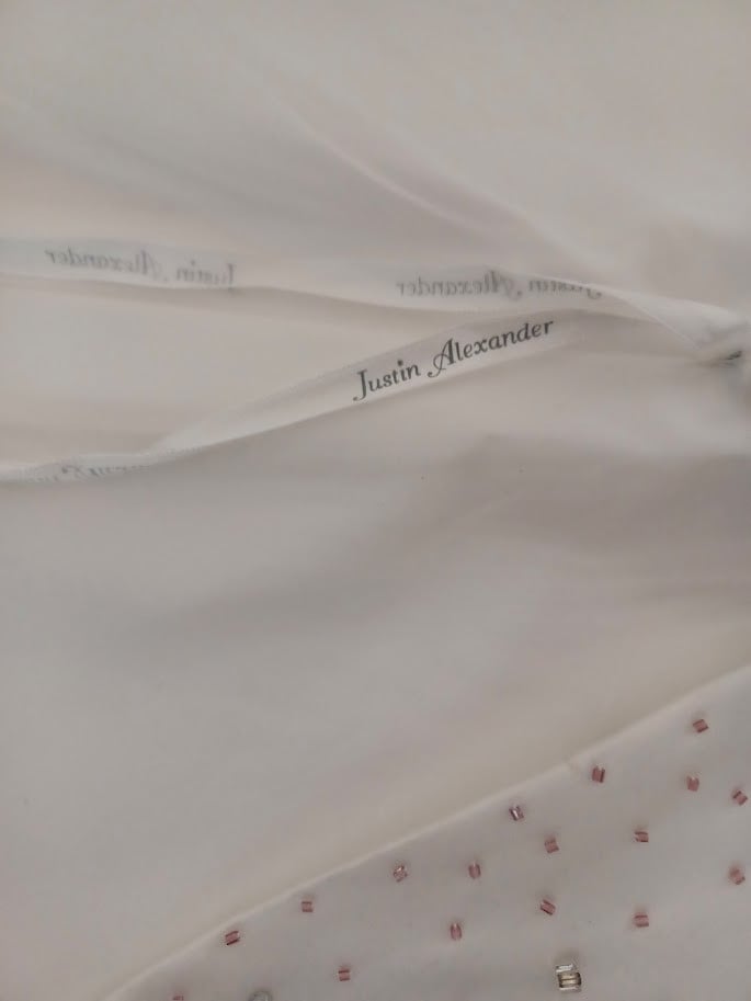 Designer trouwjurk van het merk “Justin Alexander” maat 40/42