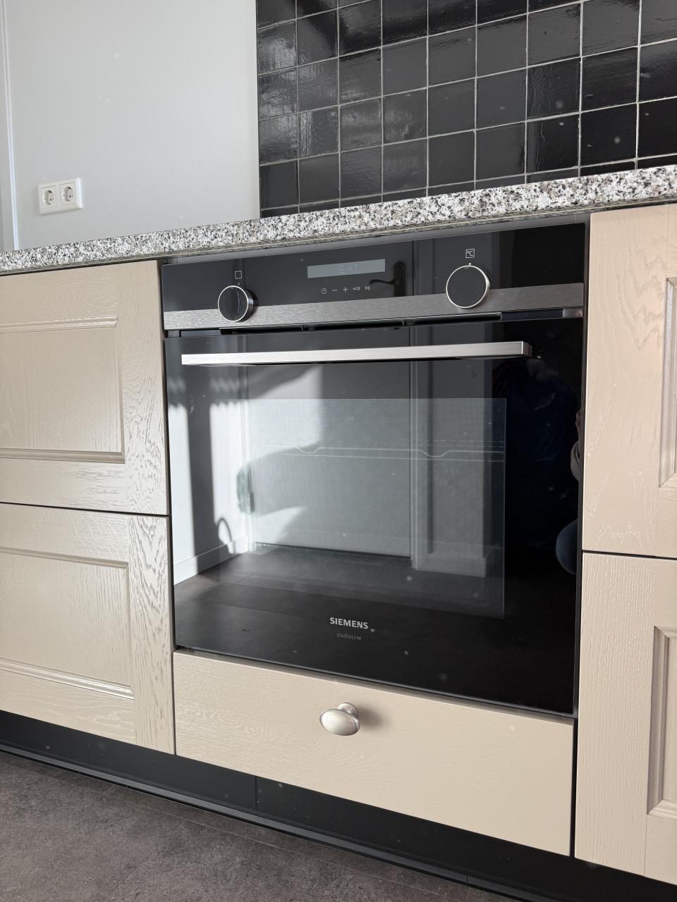 Complete hoekkeuken met Quooker, Siemens en Atag apparatuur