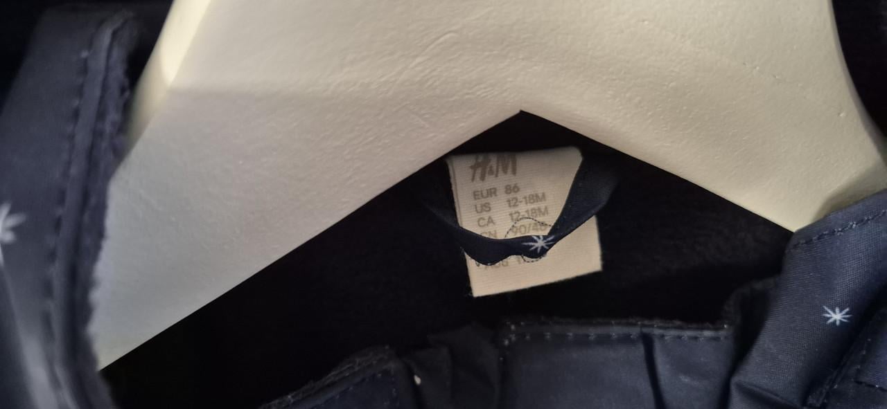 Donkerblauw skipak met sterretjes en bontkraag, maat 86