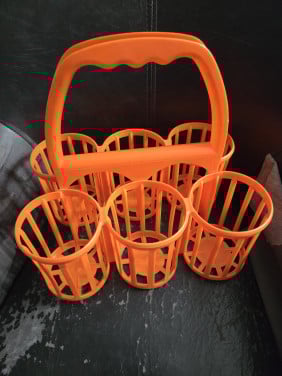 Leuke retro oranje flessenhouder. Jaren 70.  'made in holland'.