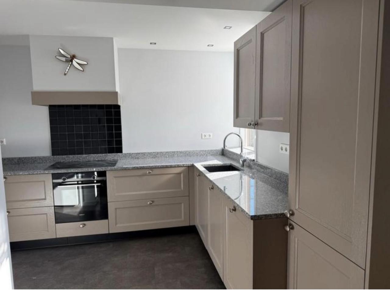 Complete hoekkeuken met Quooker, Siemens en Atag apparatuur