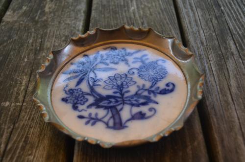 Blauw/wit aardewerk / tin flessenonderzetter