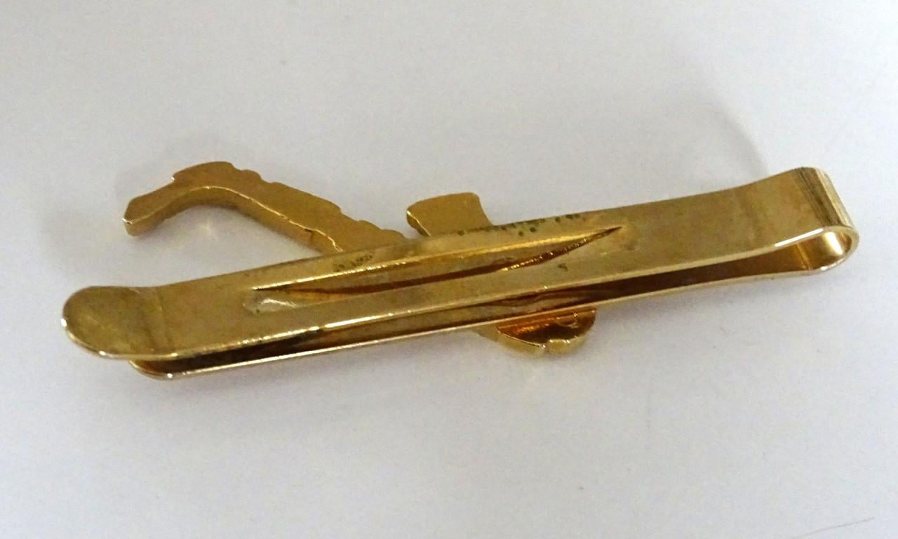 Saxofoon speldjes en manchetknoop