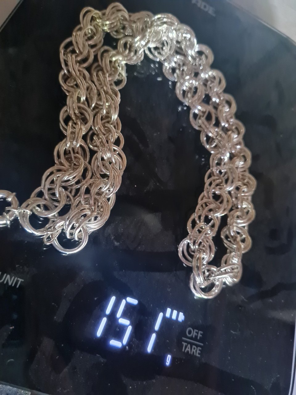 Zilvere ketting met een fantasy schakel.