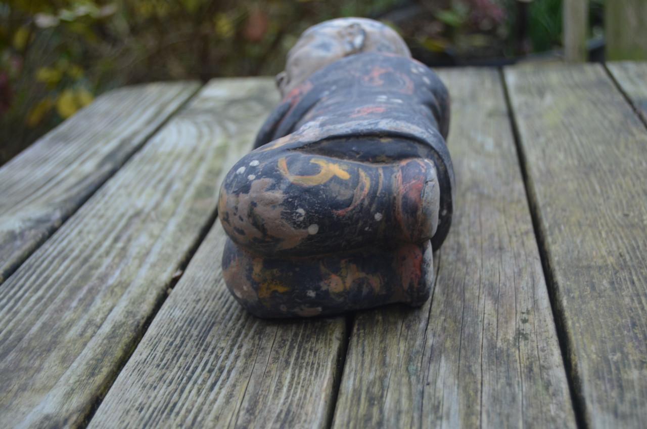 Chinees beeld van een slapend zotje ipst.