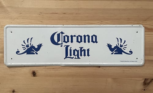 Te koop geëmailleerd reclamebord van Corona