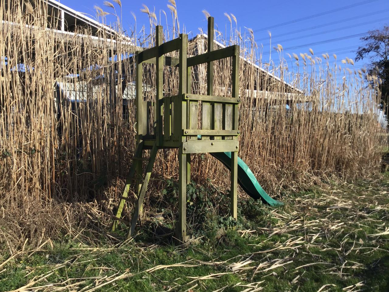 Houten Speelhuisje met glijbaan
