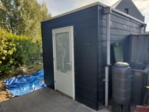 Houten schuurpanelen met kunststof coating
