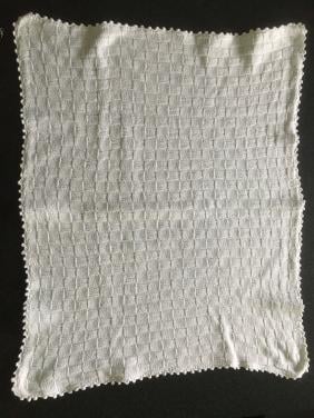 Matrasbeschermer  (gebreid) voor wieg of kinderwagen, z.g.a.n!