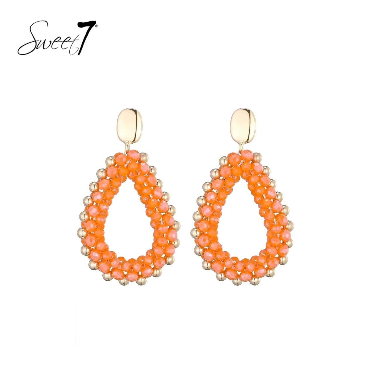 Oorbellen met oranje kralen en een goudkleurige rand