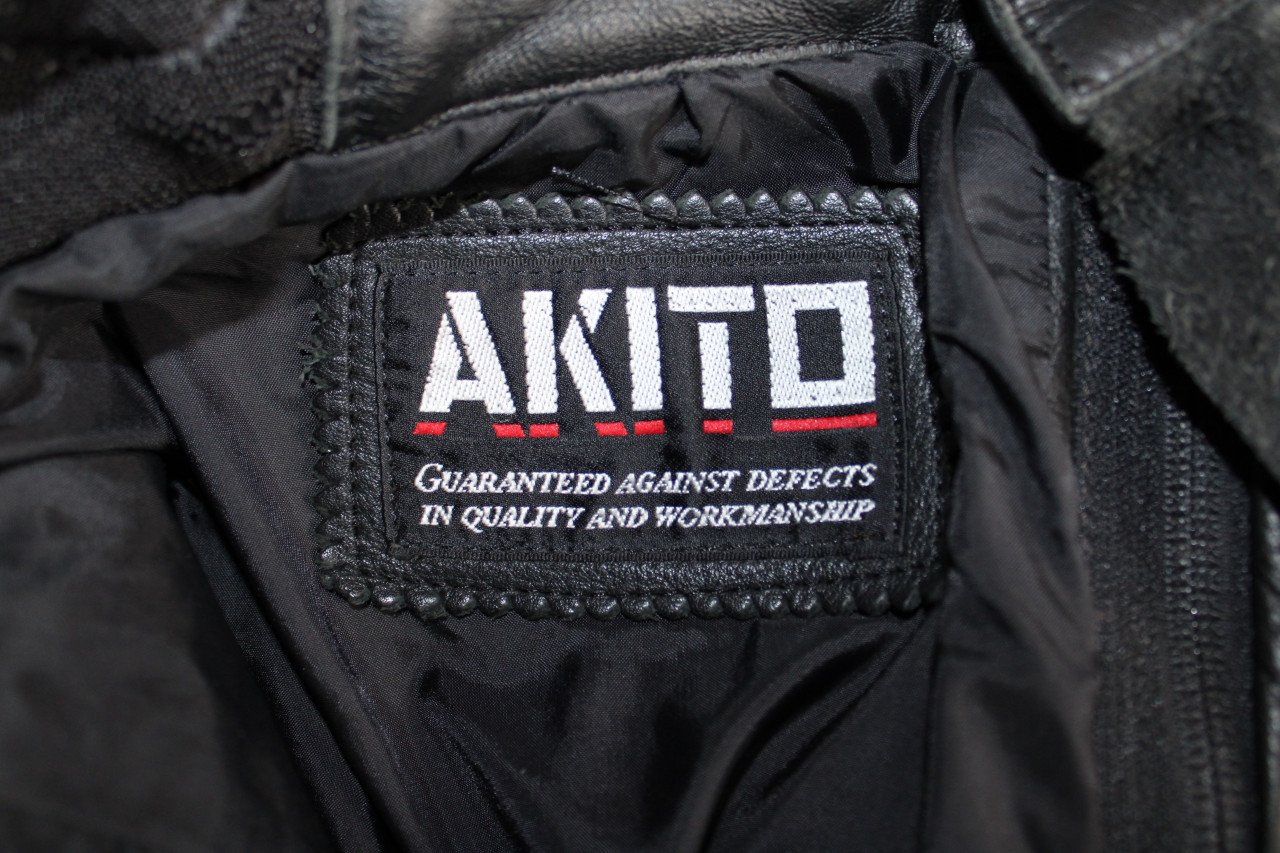Lederen motorjas met broek en regenoverall maat 64
