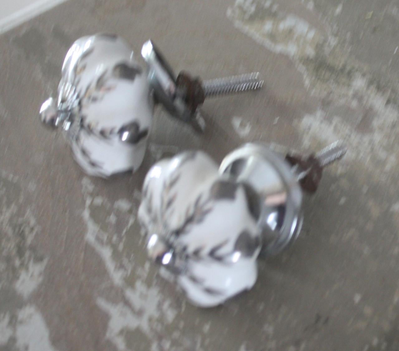 Deurknoppen steen met bloemen