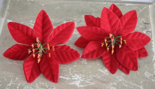 Set van 2 rode kerststerren op knijper