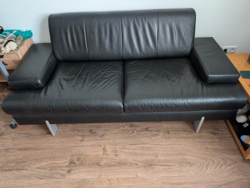 Te koop: zwarte lederen tweezitsbank van Rolf Benz