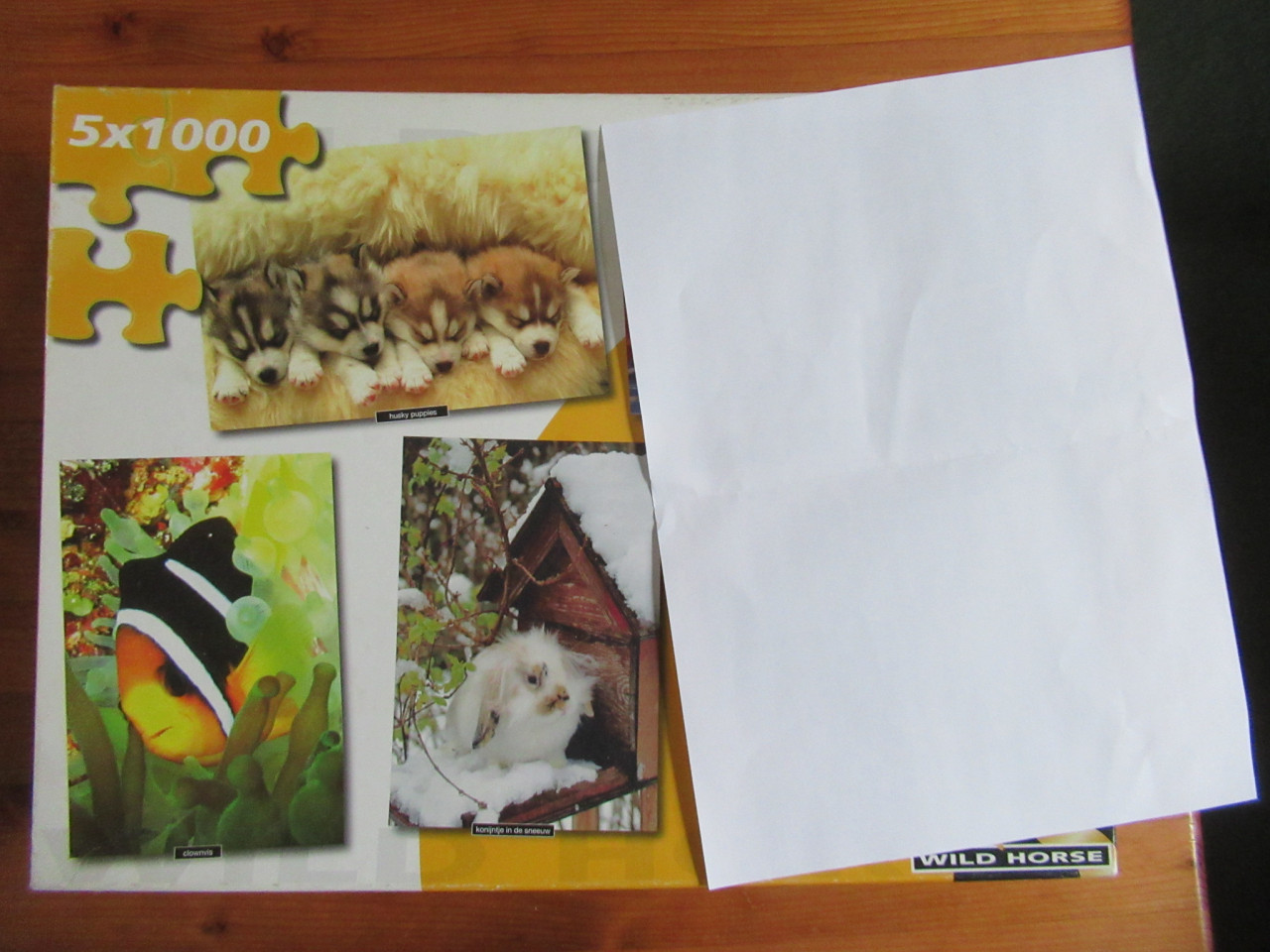 Doos met 3 leuke volledige puzzels van 1000 stukjes. zo goed als nieuw