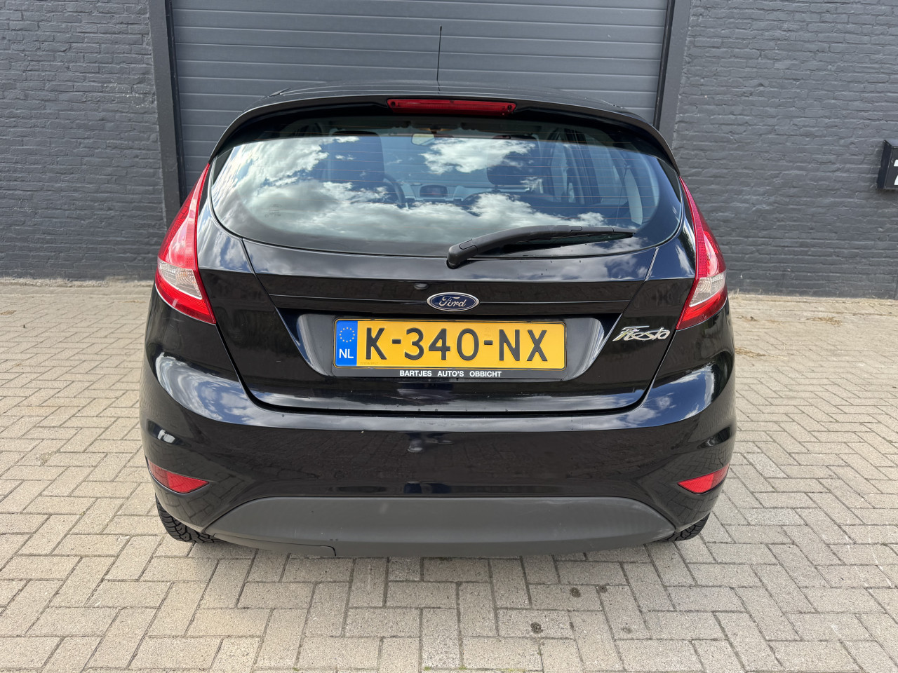Ford Fiesta 1.25 44KW Ghia 5DRS 2010 Zwart Airco Apk Nap