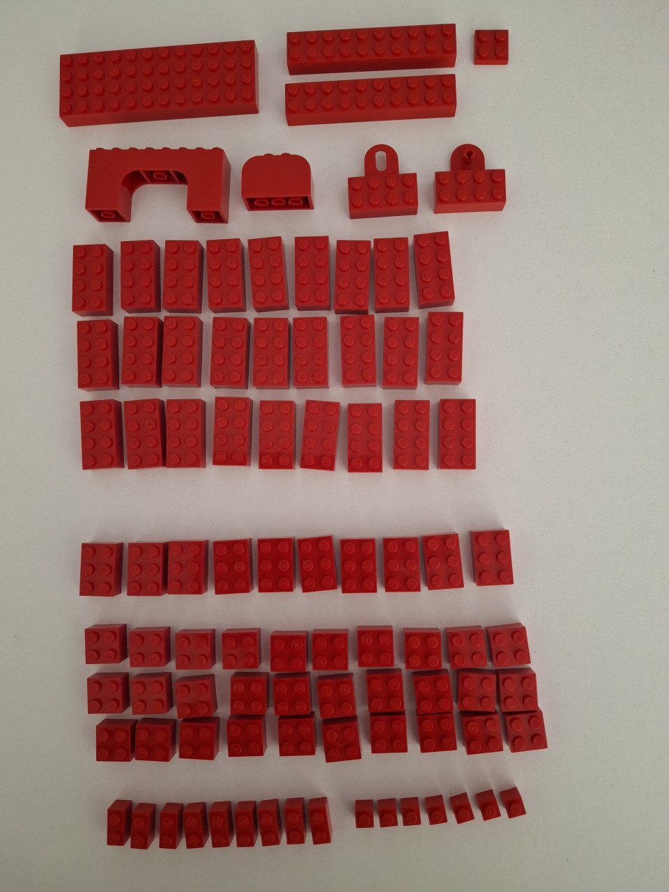 Zakje gesorteerde rode legoblokjes
