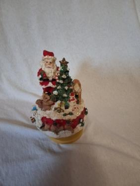 Draaiende kerstman met muziek