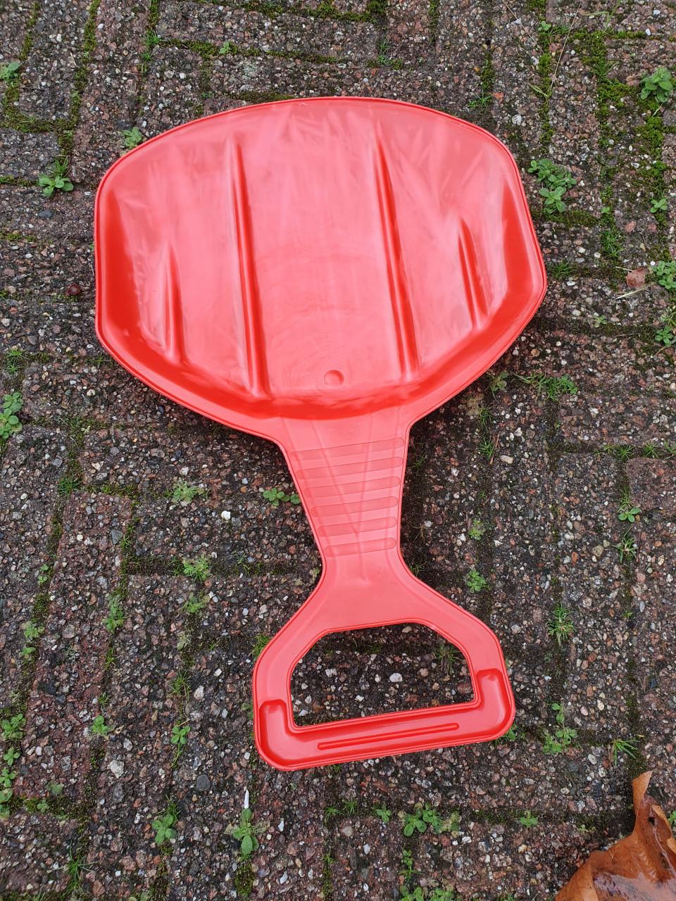 Kunststof slee met handvat