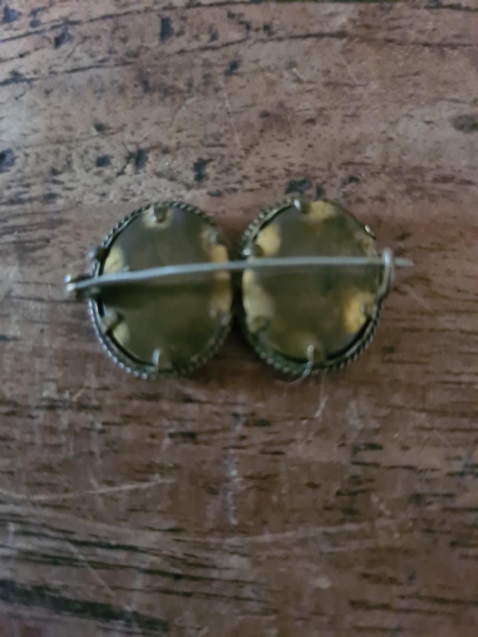 Antieke dubbele fotobroche van verguld metaal.