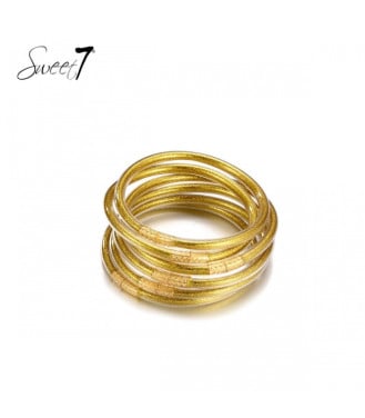 Goudkleurige bangles met in het midden een motief