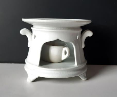 Petrus Regout wit theelicht op pootjes met vetschuitje