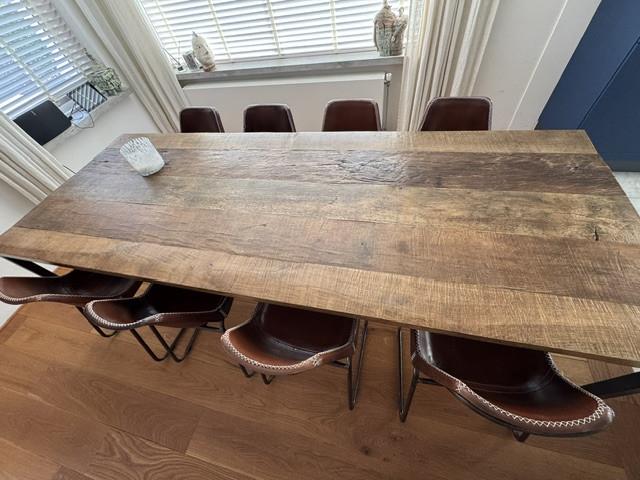 8 stuks lederen eetkamerstoelen