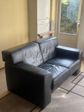 Tweedehands zwarte leren bankstel te koop aangeboden