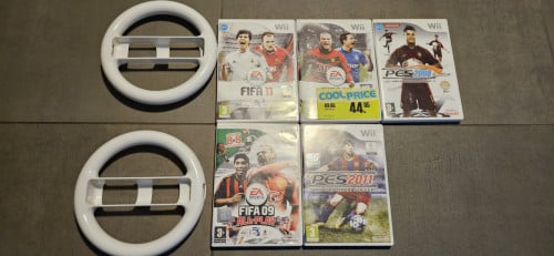 5 Wii spellen en 2 thirdparty stuurtjes