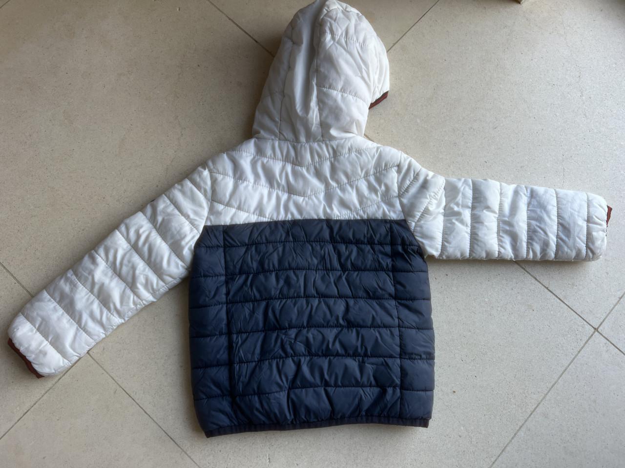 Twee winterjassen maat 104