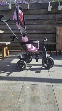 Roze meegroei kinder driewieler