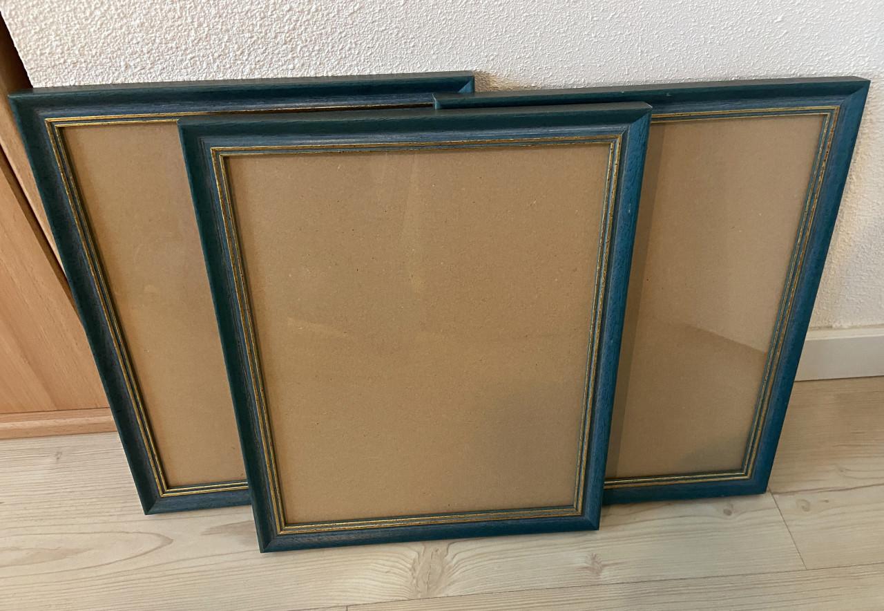 Mooie blauw/goud gekleurde fotolijsten