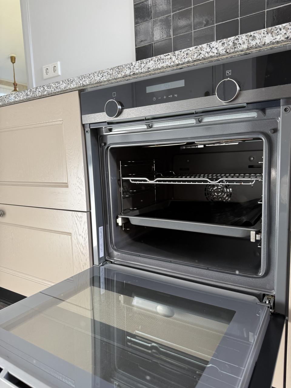 Complete hoekkeuken met Quooker, Siemens en Atag apparatuur